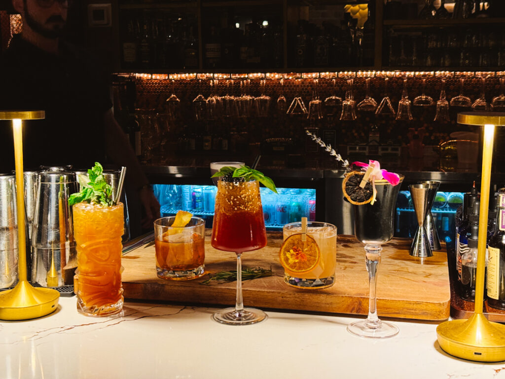 Lineup of craft cocktails at the only speakeasy in Alabama's Beaches
