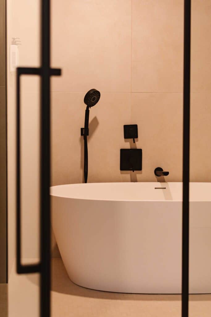 Wet room inside a hotel room where there's a soaking tub and a shower to the left (off camera)